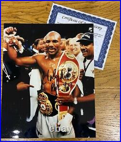 An original signed photograph by Evander Holyfield (with COA)