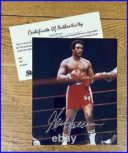 An original signed photograph by George Foreman with COA