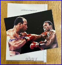 An original signed photograph by James Smith/Larry Holmes (with COA)