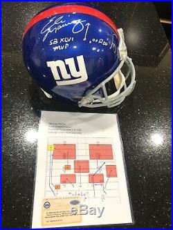 Eli Manning Autographed Football Helmet with RARE Play Inscription. Steiner COA