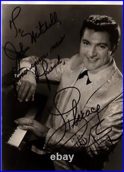 Liberace signed dedicated early b/w 10x8 photo with piano sketch. AFTAL COA
