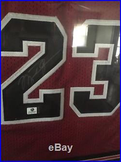 Michael Jordan Red autographed jersey, Framed (black frame) With COA
