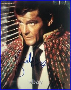 Roger Moore autographed James Bond photo adding 007 after signing with COA
